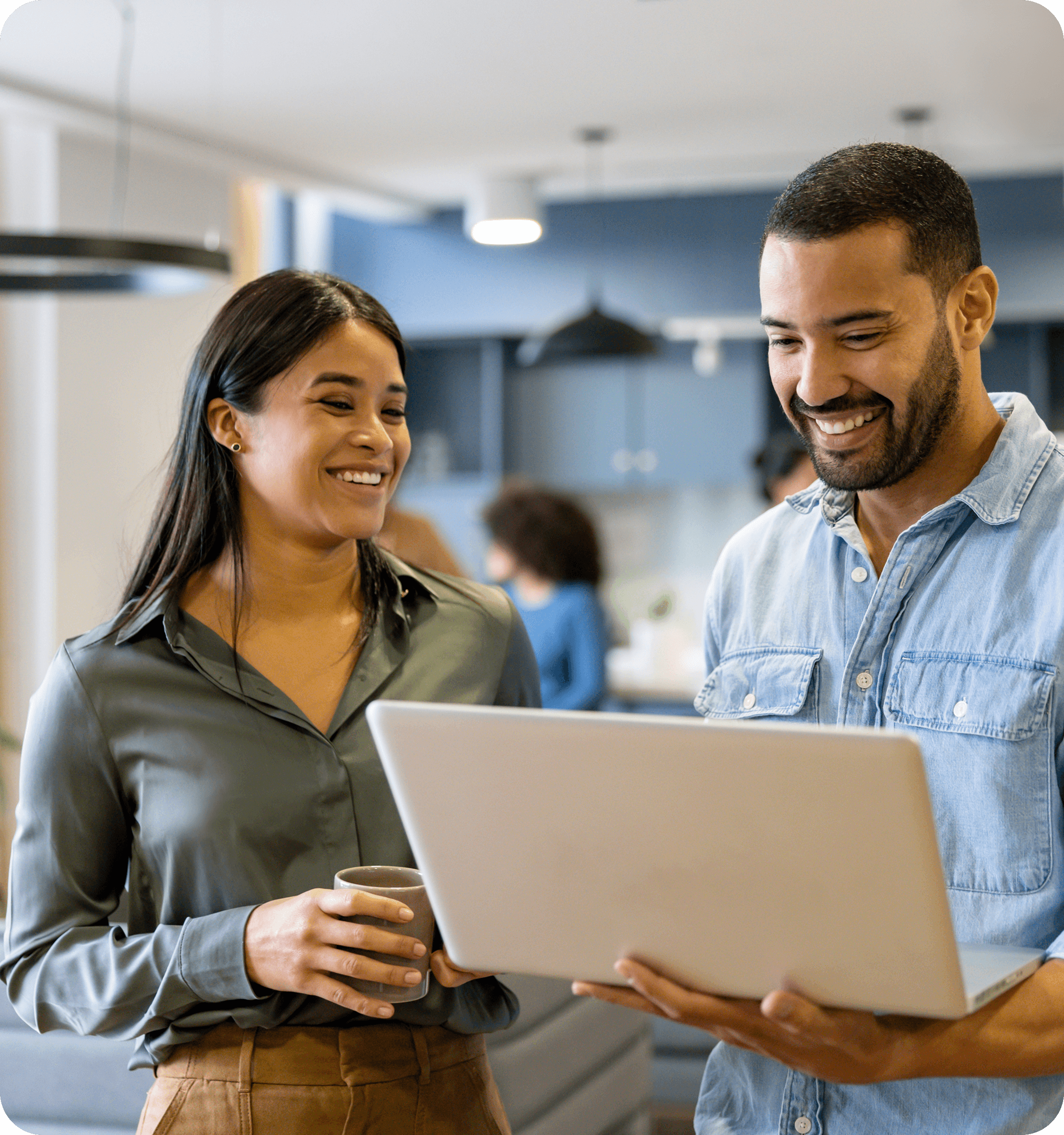 Two people reviewing information on a laptop