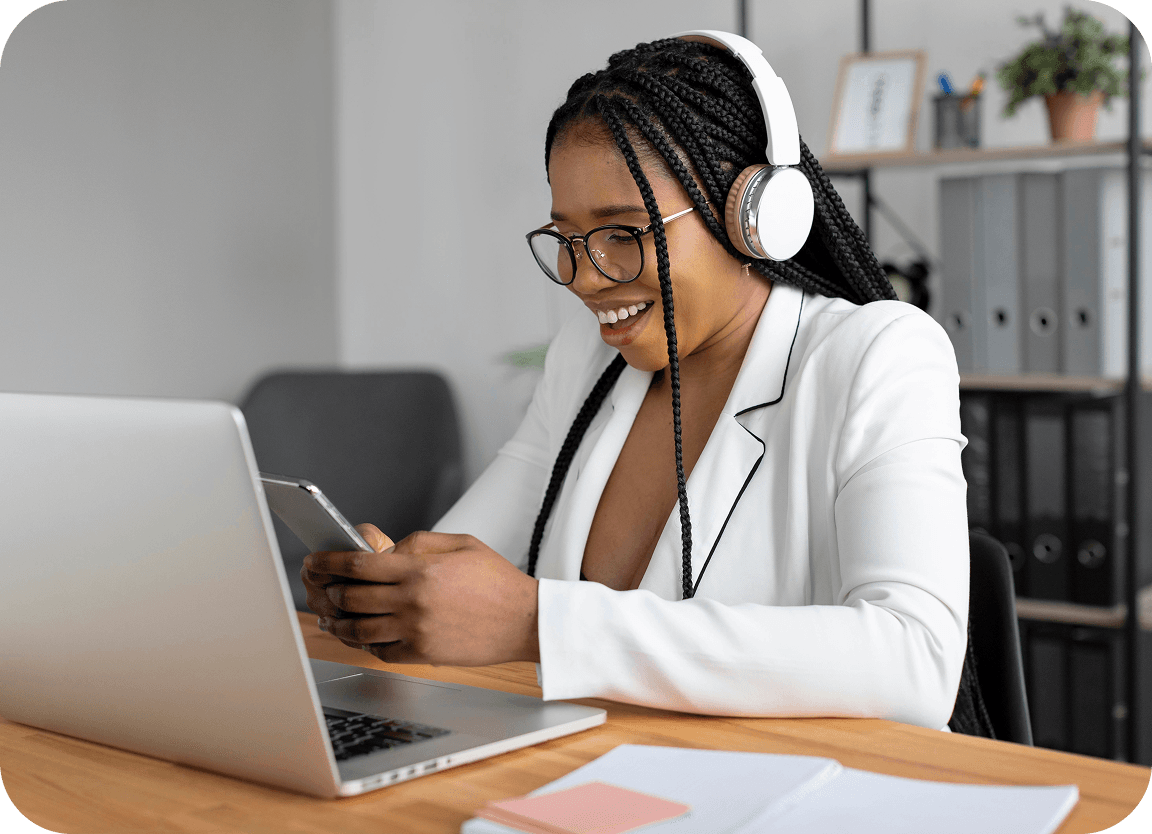 Parent working with a provider on a laptop with headphones